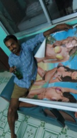 Dr Ravi glorying in his white elephant gift. it looked to be itself the product of a photoshop battle to see who could make the most unrealisiticly proportionate women